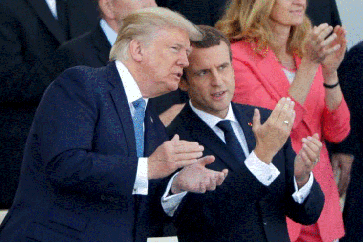 Tổng thống Php Macron v Tổng thống Mỹ Trump tham dự lễ diễu binh kỷ niệm Quốc khnh Php tại Paris (Php) ngy 14-7. Ảnh: REUTERS