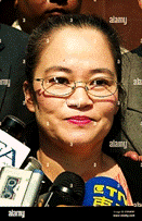 Katrina Leung, of San Marino, California, accused of being a double agent  speaks to reporters outside federal court July 8, 2003 in Los Angeles after  a hearing in her case. Leung and